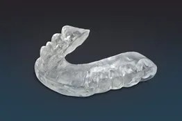 Clear custom occlusal guard dental appliance for teeth grinding protection